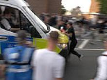 Moment protester at anti-migrant demo is run over by a police van: Thugs clash with officers near asylum hotel after Ethiopian resident was charged over schoolgirl sex assault