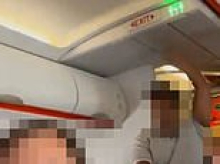 Terrifying moment easyJet passenger yells 'I've got a bomb' on packed flight before hero pins him down