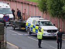 Woman found 'murdered' and two others 'feared harmed' after arrested armed robbery suspect sends cops to house