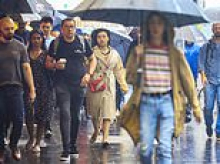 Rain bomb alert as mammoth weather system moves across Australia and temperatures plunge - as city records wettest day of the year