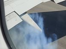 Moment terrified Brit family watch passenger jet tyre EXPLODE during take-off at Greek airport - before military plane shadows them ahead of 'brace position' emergency landing