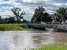 Desperate search is launched for missing woman after she was swept away in floodwaters while in a car