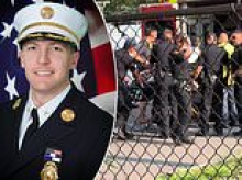 Fire chief suspended after he was filmed shouting 'Shut the f**k up!' at girl, 10, being stretchered into ambulance