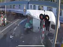 Driver cheats death when his van is obliterated by train after he got caught trying to jump a red light (but can YOU see the simple way he could have escaped?)