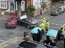Bins on busy junction are making an accident blackspot, families warn