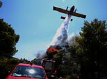Deadly Greek wildfire is battled by firefighters as strong winds raise spectre it could spread and could widespread devastation