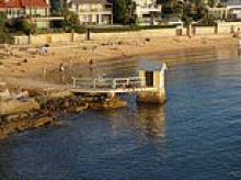 War erupts in affluent suburb as backlash escalates over a change at a small beach and locals lawyer up while a Hollywood star steps in