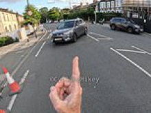 Bike vigilante Cycling Mikey returns to scene where he pushed his bike in front of a car to perform same stunt AGAIN