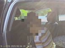 Moment sweat-drenched child is rescued from sweltering Utah car while mother was taking driving test