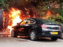 Moment family's car bursts into flames in front of horrified shoppers as temperatures hit 30C