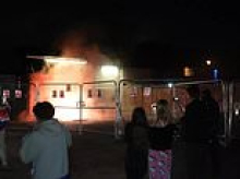 Chaos outside Epping's migrant hotel as protest videos emerge of lit flares 'being thrown' from windows whilst 'terrified' residents claim 'fireworks were aimed at building'