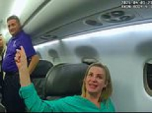 Chanel-toting 'Karen' treats cops like servants as she's marched out of plane's first class cabin for entitled behavior