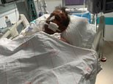 'I would sleep there if I could, but I can't': Father, 64, is dying in a Turkish hospital after a crash... but his British family is only allowed to see him for 10 minutes a day
