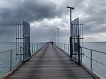 Urgent search launched for missing fisherman after boat capsized off the Mornington Peninsula