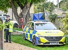 Woman, 49, fights for her life in hospital under police watch after girl, nine, died at house in Cotswolds village