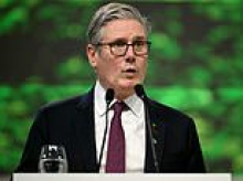 Another slip Keir? Starmer narrowly escapes a tumble as he arrives at COP30... before telling summit that Labour is 'all in' on Net Zero despite admitting climate consensus 'is gone'