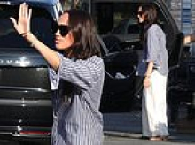 The smile that says, 'Hollywood here I come!': Meghan is seen on set for the first time filming new comedy movie where she plays HERSELF