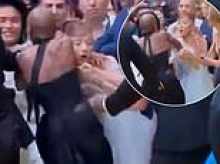 Ariana Grande is ambushed by fan at Wicked: For Good premiere as Cynthia Erivo leaps in to protect her co-star