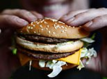 Man, 22, fights for life after swallowing a whole burger without chewing it 'for a joke'
