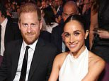 Prince Harry and Meghan Markle pose with celebrity psychic and send her a quasi-royal letter with the Duchess' royal cypher - before hinting at an upcoming trip