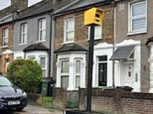 Frustrated residents put up fake speed camera to deal with speeding drivers on their road - only for council workers to remove it as it starts working