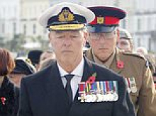 Police charge 'fake admiral' Jonathan Carley days after appearance at a Remembrance Sunday event with a chest full of suspicious medals sparked fury