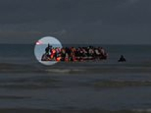 Moment suspected people smuggler 'fakes' falling off small boat to evade suspicion from police