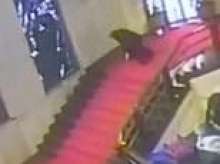 Shocking moment Sardinian politician trips and falls head first through priceless stained glass window