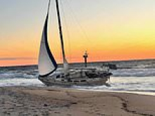 Captain became an instant celebrity when his yacht washed up on an exclusive beach... now he's vanished as his dark past emerges