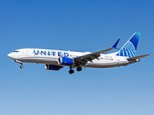 United passenger is arrested for mid-air bomb threat as flight makes emergency landing in St Louis
