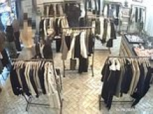 Shocking moment gang of thieves ransack London clothing store and make off with £1,700 worth of goods as terrified staff watch on helplessly