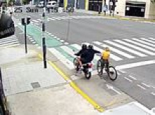 New footage shows moment phone thief is hit by instant karma as bystanders rush to tourist's aid after snatcher grabs her device - then is attacked by passersby