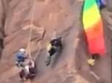 Heart-stopping helicopter rescue of BASE jumper dangling from Utah canyon by their rainbow parachute is caught on camera