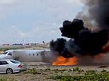 Moment minister's jet bursts into flame as it crashes after shooting off the runway while landing in Democratic Republic of Congo