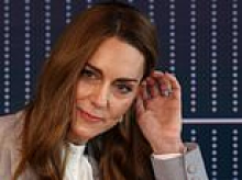 Kate Middleton rings the changes with a stack of FOUR glittering bands on her wedding finger - including Princess Diana's sapphire and two gifts from Prince William