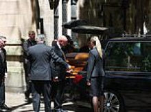 Russell Crowe delivers stirring eulogy for John Laws in front of a Who's Who of Australian showbiz and politics at radio icon's state funeral - and the signature item in front of Golden Tonsils' casket
