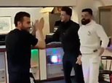 The parties inside Britain's biggest asylum seeker centre: Migrants dance with the help of disco equipment in new video