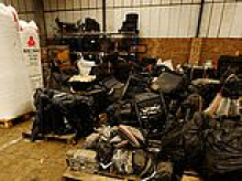 The stolen car graveyard: Inside huge warehouse packed with 'chop shop' vehicle parts that were intercepted by police before being shipped off across the world