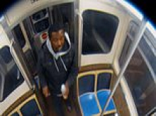 Chicago commuter charged with terrorism after he 'doused woman in gasoline then screamed 