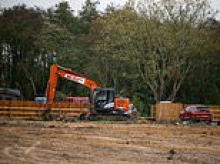 Travellers build illegal site of 13 static homes next to Britain's biggest nuclear weapons factory as fearful residents call on council to step in