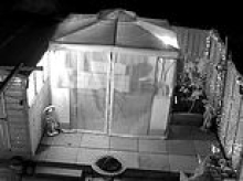 Moment angry neighbour sets army veteran grandfather's gazebo on fire while he is soaking in the hot tub 'because he was jealous of his nice garden'