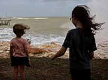 Thousands brace for impact as Tropical Cyclone Fina bears down on Darwin - as Aussies strip supermarket shelves bare ahead of the storm