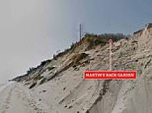 Meet the man who bought a doomed house on Norfolk's collapsing coastline for £125k… because he 'didn't know' it was yards from disaster