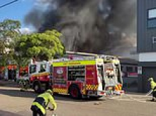 Massive factory inferno erupts in Brookvale on Sydney's Northern Beaches - as fire crews battle to contain the blaze