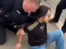 Teen girl learns a brutal lesson when she throws a drink over police officer's head during anti-ICE protest