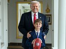 Trump's in grandpa mode! President catches football with doting grandson Theodore, 9, at White House
