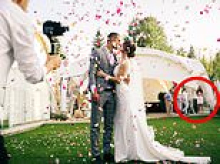 I spotted a woman I'd never met before in our wedding photos... then I found out who she was: 'Insane'