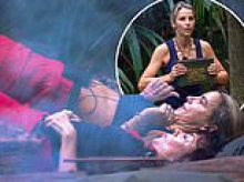 I'm A Celebrity's Vogue Williams shows off her toned abs as she leads the camp through a jungle fitness routine