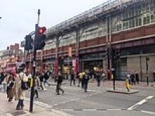 'People are morons': The curse of 'button edgers' who refuse to press the traffic light buttons and clog up city streets'