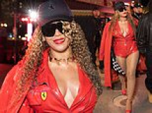 Beyoncé is praised for 'not giving into Hollywood's trend with Ozempic' as she delights fans by showing off her incredible curves in a plunging PVC playsuit at the Las Vegas Grand Prix